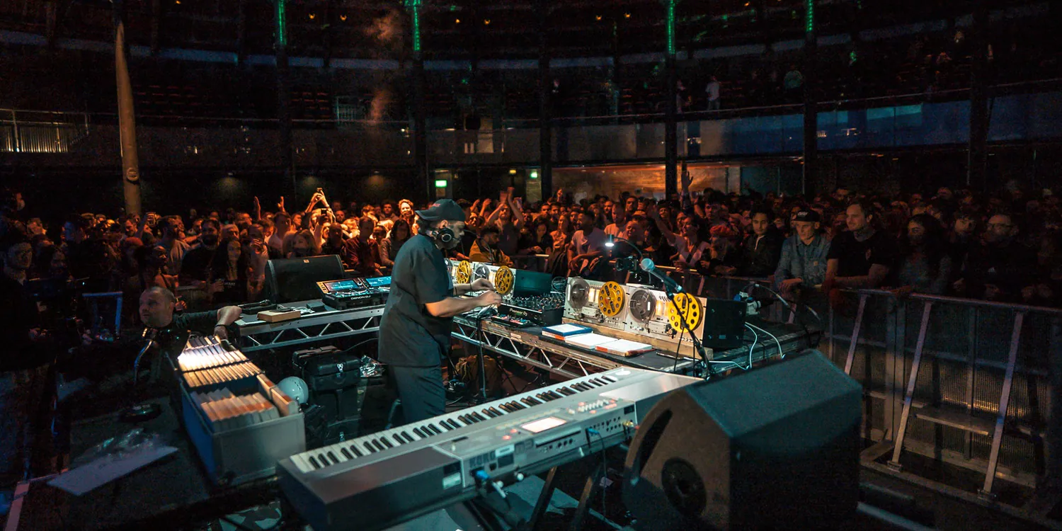 Kerri Chandler performing a reel-to-reel session in front of a crowd