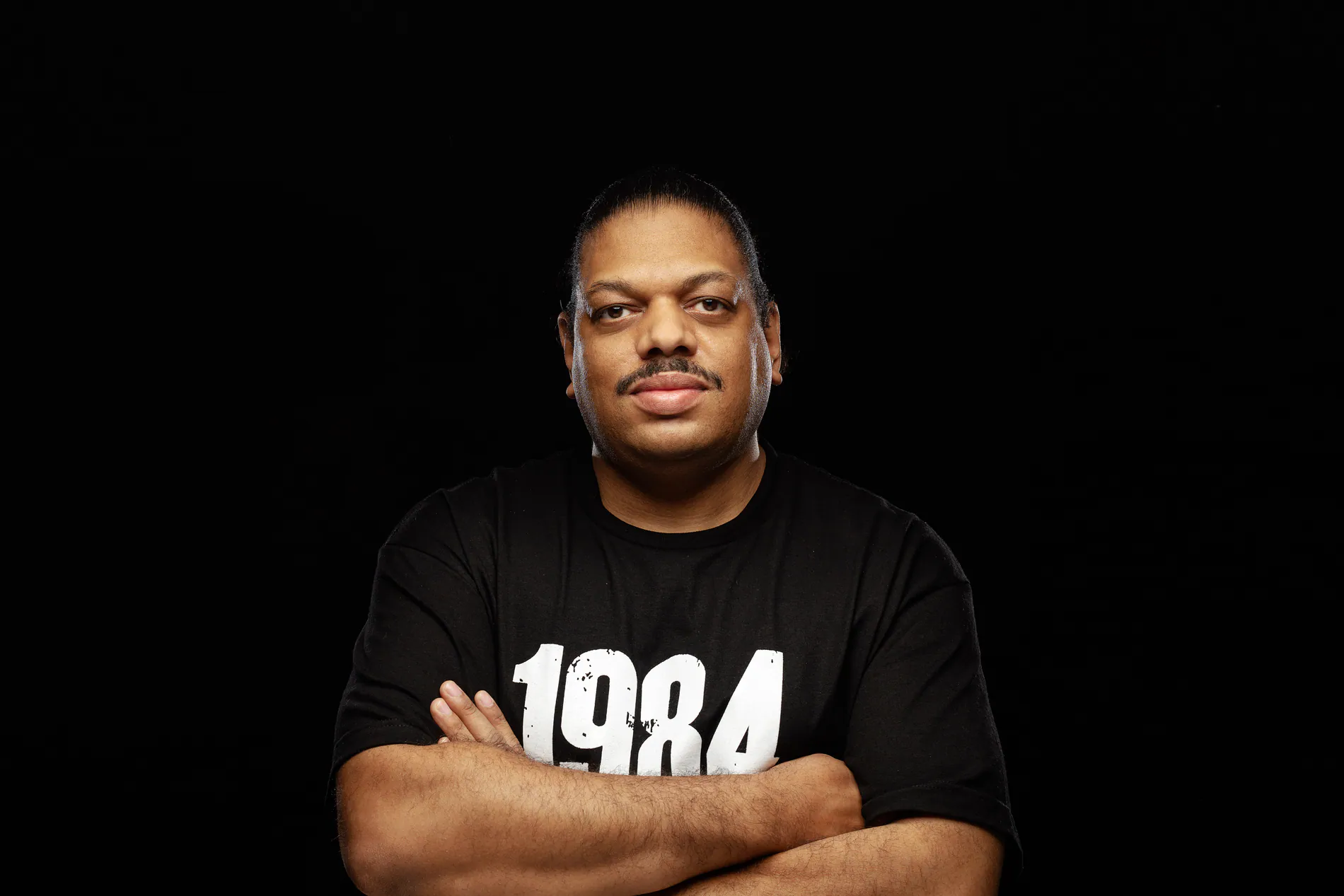 Kerri Chandler press portrait on black background, shot by Joe Finch